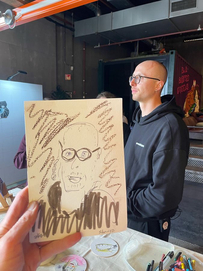 Live portrait drawing setup with guest and drawing board